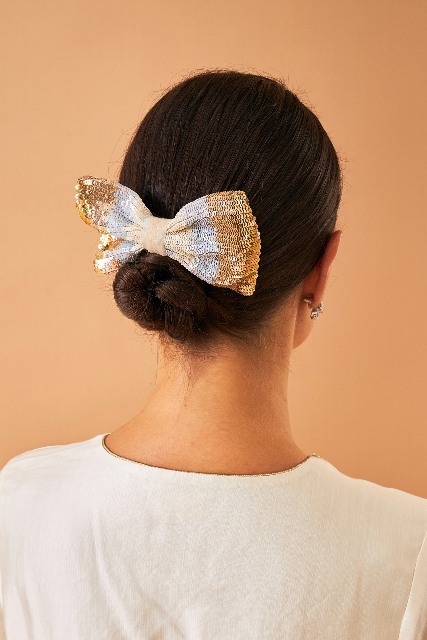 Gold Serena bow on women